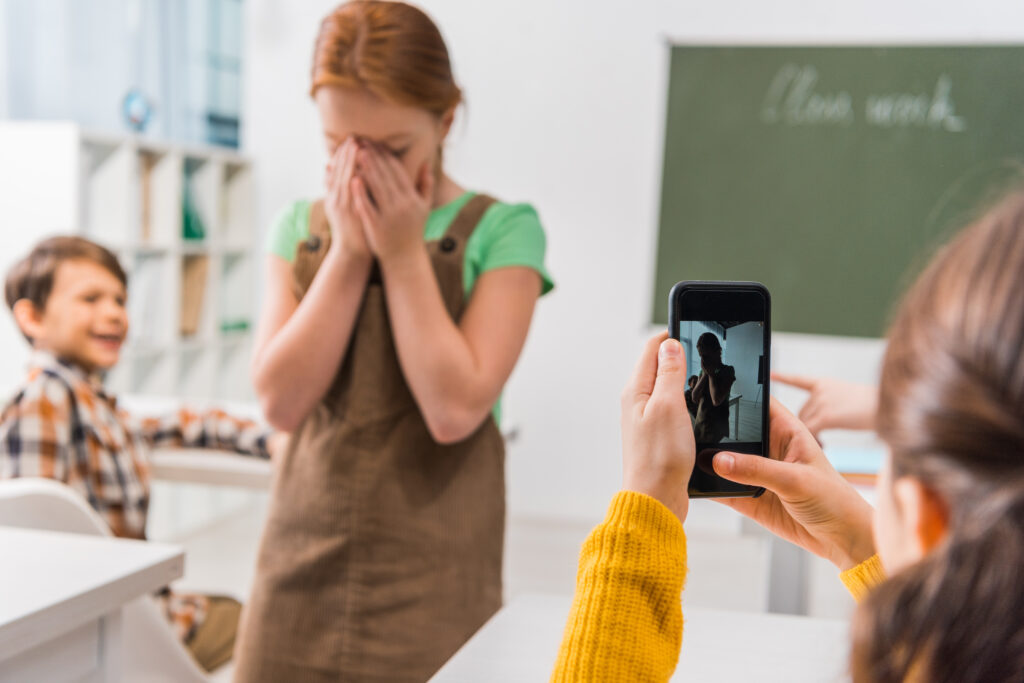 cyberbullying illustration : schoolgirl taking photo of classmate