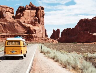 yellow Volkswagen van on road